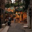 A picturesque alley in Karaköy, İstanbul, adorned with colorful umbrellas and vibrant cafes.