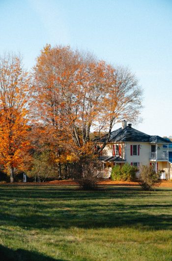Beautiful fall foliage surrounds a quaint house in North Hatley, Québec.